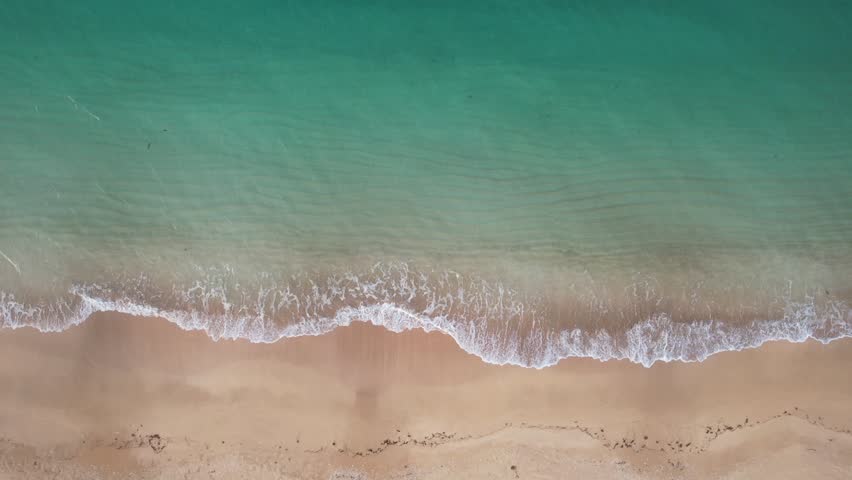 Phuket Thailand Fiji tropical beach Aerial drone top down zoom out view, bird eye view of azure waves and sand. Beautiful sea wave come to beach. Sky blue shallow water paradise copy space concept Royalty-Free Stock Footage #1110177587