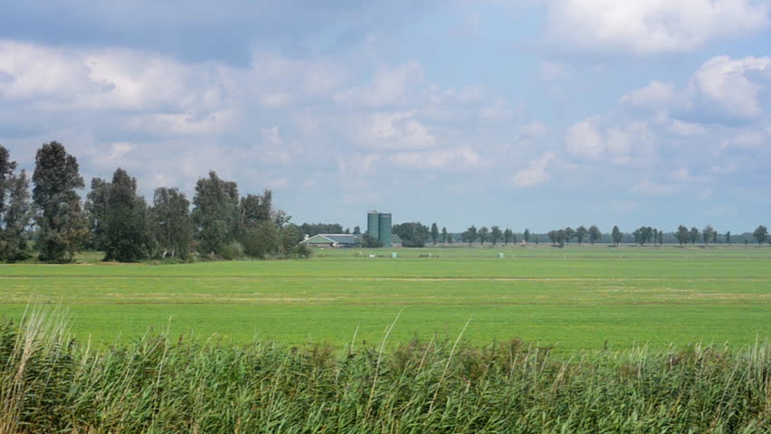 Dairy farm with silos, TRACKING SHOT.
