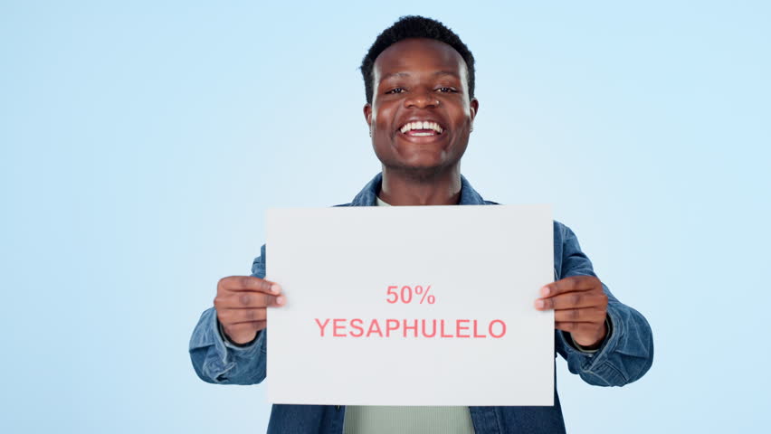 Discount, poster and face of happy black man in studio with retail, fashion or news on blue background. Retail, sale and portrait of male model with banner, deal or shopping, promo code or offer