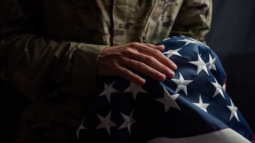 Soldier caressing the stars of a usa Flag on veterans day  Royalty-Free Stock Footage #1110195531