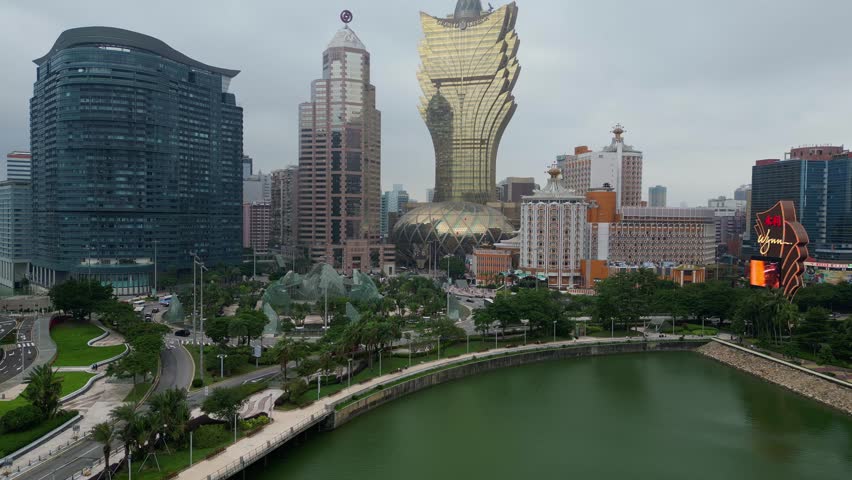 Macau, China - October 16 2023: Aerial drone footage of the famous Macao skyline with the iconic Grand Lisboa casino and the Nam Van lake waterfront in Macau SAR in China. Shot with an upward motion