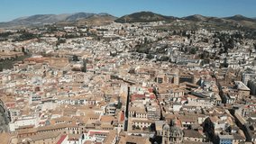 Picturesque aerial video of Granada, a historic town near the Sierra Nevada mountains in Andalusia region, south Spain