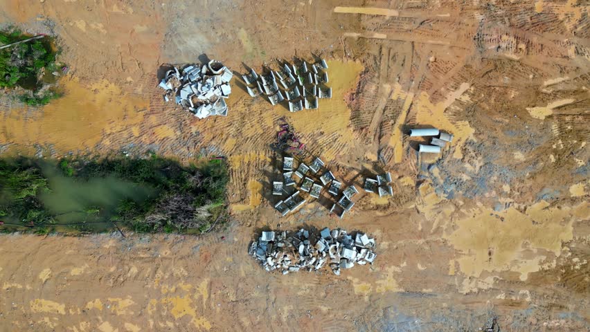 Aerial shot look down construction work material at yellow soil site