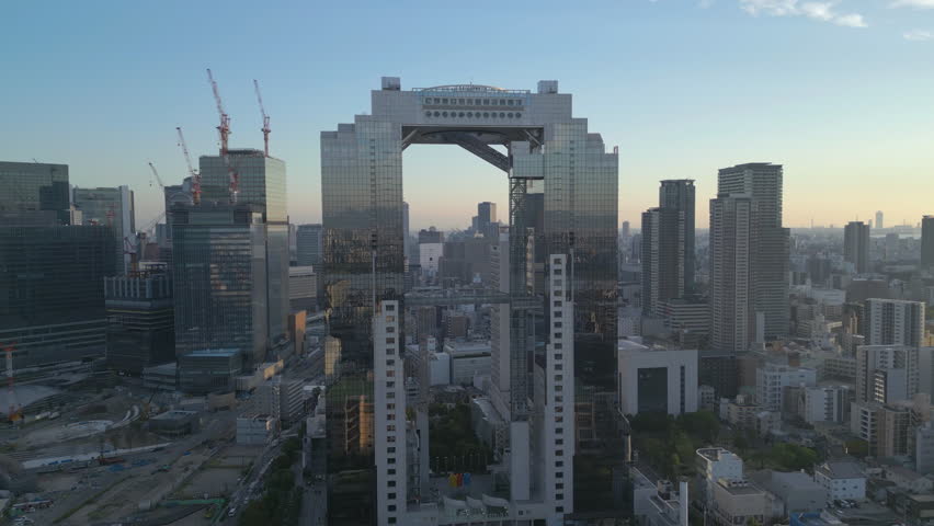 wide flying right view of Umeda Sky Building in Osaka Japan