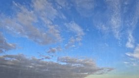 timelapse clip of rain on nice blue sky with little clouds - loop video