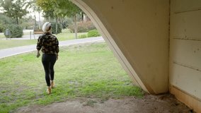 Woman standing under bridge then turning off smartphone and leaving.
Slow motion pan left of young female wearing glasses standing near graffiti on wall then going to park with green trees - Powered by Shutterstock - Get 15% off with code: PIKWIZARD15
