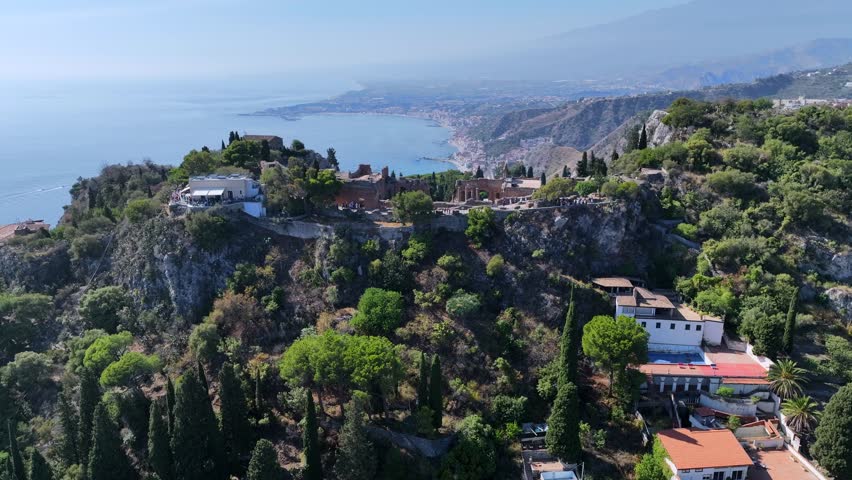 Ancient Theater of Taormina in Sicily, Italy.
Spectacular view from above of the Greek Amphitheater, a tourist attraction for foreign visitors. Royalty-Free Stock Footage #1110229315