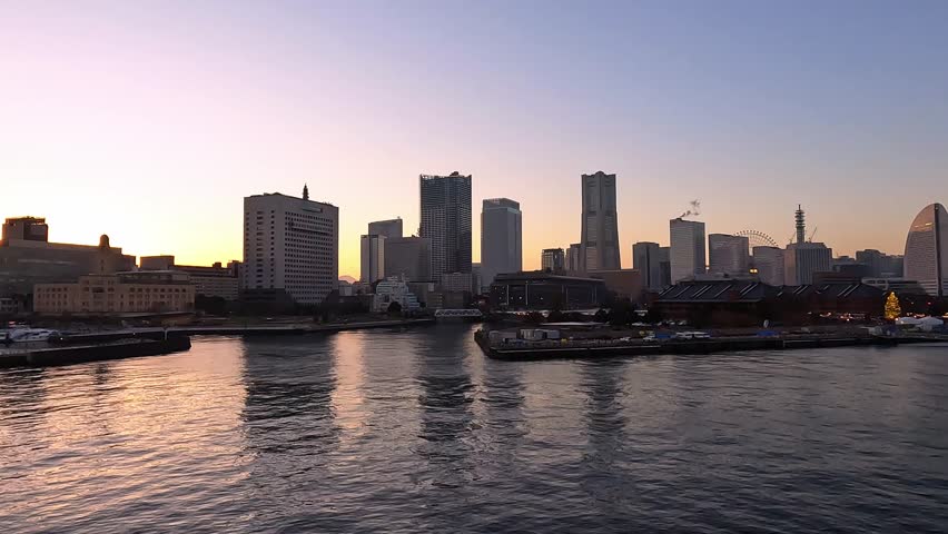 sweet gold sunset winter and light illumination from Cityscape of Yokohama city, Skyline and office building and downtown in Minatomirai Area, Yokohama city port, Kanagawa, Japan