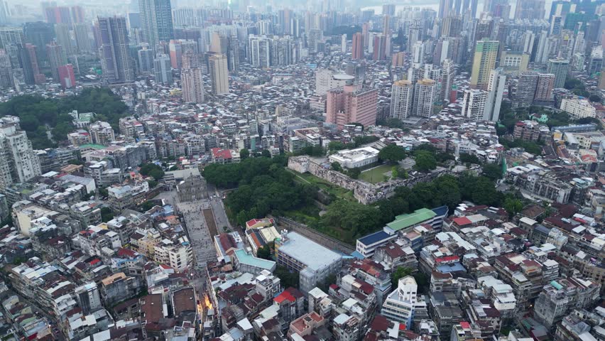 Macau, China: Aerial drone footage of the Macau historical district with the ruins of the Saint Paul cathedral and the Monte Fort, home of the Macao museum in the former Portuguese colony
