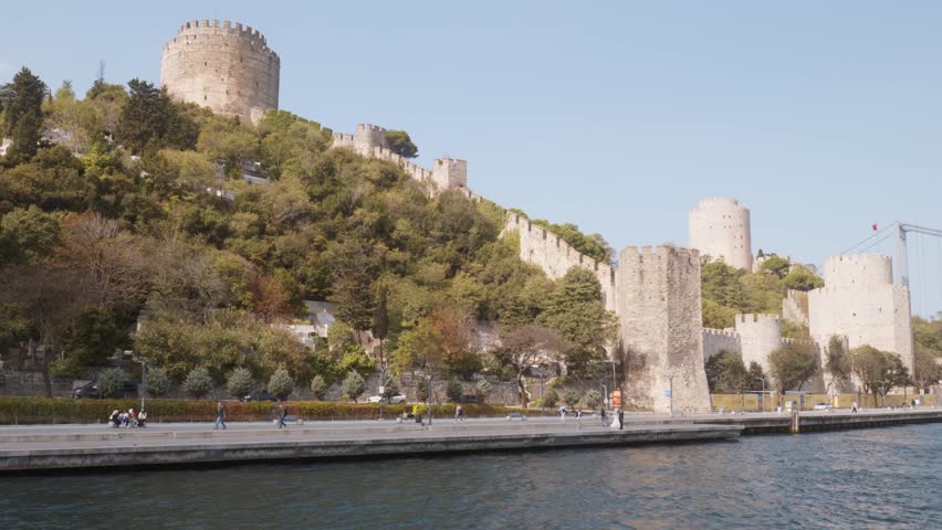Rumeli stone Fortress shores of Bosphorus strait cruise boat scenery
