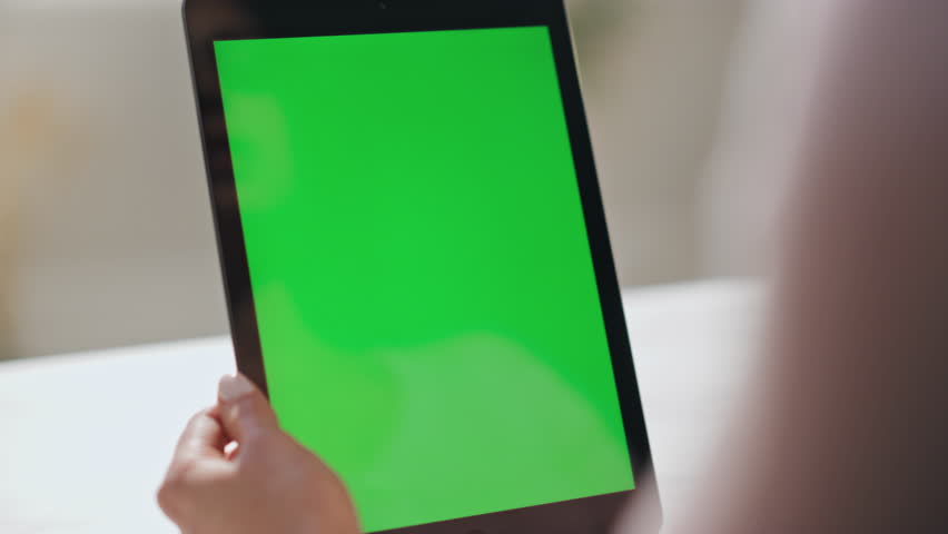 Woman talking to greenscreen tablet web camera having video conference indoors closeup. Unrecognizable businesswoman videocalling using mockup pad computer at office. Girl working at chroma key device Royalty-Free Stock Footage #1110241601