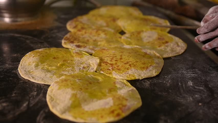 Boli or holige or puran poli or bobbatlu is an Indian sweet flatbread that originates from South India and Maharashtra. Royalty-Free Stock Footage #1110244539