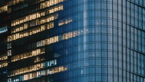 Day to night time-lapse timeslice effect blinking office windows lights, high-rise glass skyscraper business building in city downtown, work non-stop, turn on and off, endless work without breaks - Powered by Shutterstock - Get 15% off with code: PIKWIZARD15