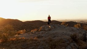 Aerial orbit around woman with her pet dog friend enjoying sunset in Arizona - Powered by Shutterstock - Get 15% off with code: PIKWIZARD15