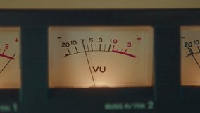 Analog volume unit meter on cassette deck, arrow moving synchronically to music and showing level of sound. Close-up view, zoom shot - Powered by Shutterstock - Get 15% off with code: PIKWIZARD15