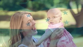 Composite video of waving honduras flag over caucasian mother playing with her daughter in the park. Patriotism and motherhood concept