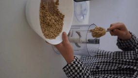 pouring porridge into a blender vertical video