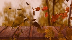 Animation of happy thanksgiving text and maple leaves floating over wooden plan against forest park. Thanksgiving and fall season concept - Powered by Shutterstock - Get 15% off with code: PIKWIZARD15