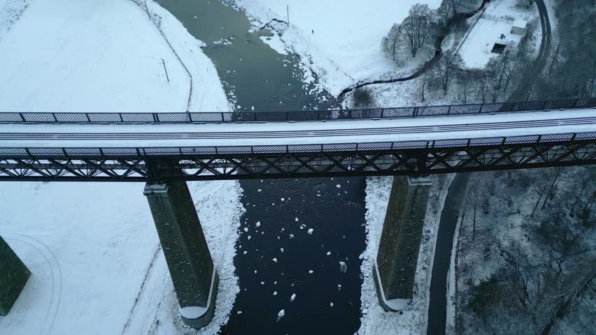 Tilting camera up and reversing while descending below the Findhorn Viaduct 