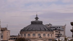 Romanian Atheneum. 4K video with Romanian Atheneum landmark building in Bucharest during an autumn cloudy day. Travel to Romania.