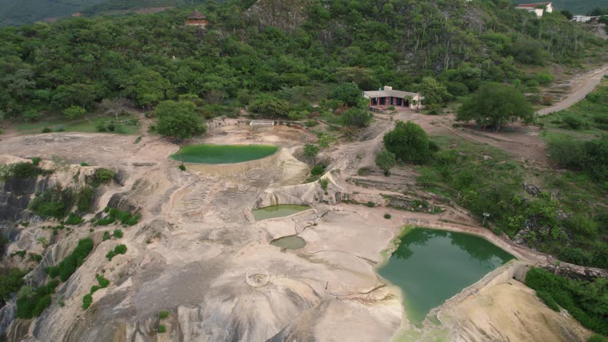 Aerial of Hierve el Agua, which translates to "the water boils," a series of stunning mineral-laden rock formations that resemble cascading waterfalls, Mexico. Enchanting destination