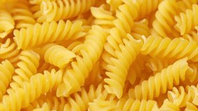 Zoom frame uncooked italian pasta, rotation