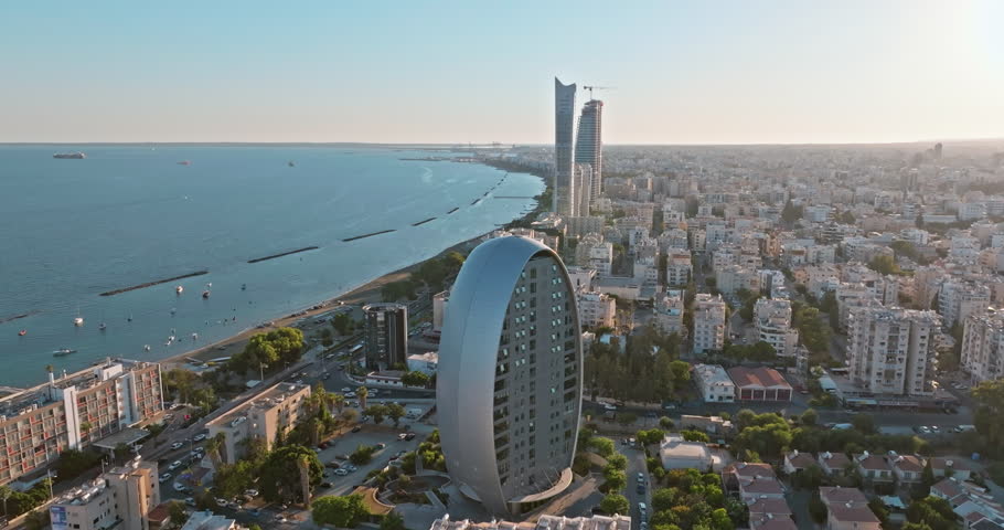 Aerial view of the cityscape of Limassol, Cyprus. The Oval building is an office building in the business center of the city. High quality 4k footage Royalty-Free Stock Footage #1110268051