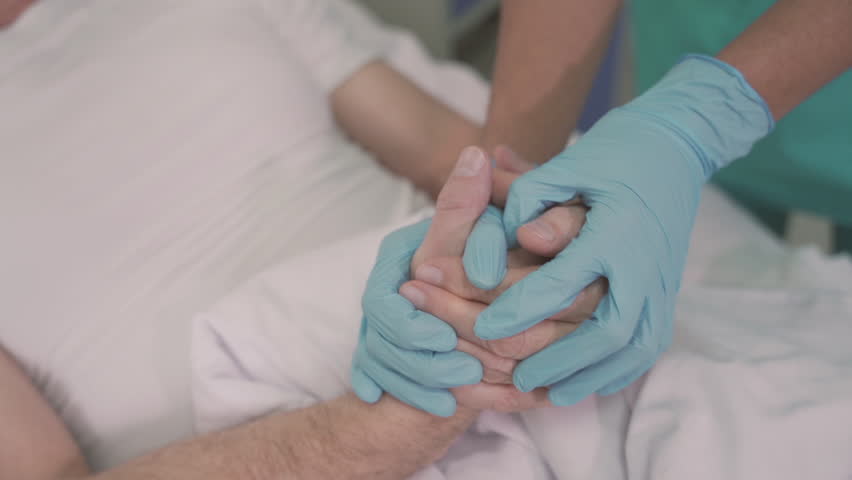 Detail Of A Nurse's Hands With Gloves Grasping And Comforting The Hands Of A Sick Patient On Hospital Bed Royalty-Free Stock Footage #1110268275