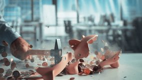 Anonymous Person's Hand Smashing a Cute Pink Piggy Bank with a Hammer. Financial and Business Safety Concept, Bank Savings and Investments Theme. Super Slow Motion Footage with Speed Ramp Effect - Powered by Shutterstock - Get 15% off with code: PIKWIZARD15