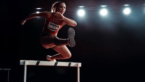 Cinematic Super Slow Motion Footage of Hurdling with Speed Ramp Effect. Strong Female Athlete is Running Towards an Obstacle, Jumping Over the Barrier at High Speed while Sprinting in a Race - Powered by Shutterstock - Get 15% off with code: PIKWIZARD15