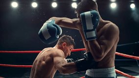 Cinematic Boxing Match in Super Slow Motion. Boxer Avoiding a Punch and Countering with a Hook to the Body, Surprising the Opponent. Aesthetic Footage with a Speed Ramp Action Effect - Powered by Shutterstock - Get 15% off with code: PIKWIZARD15