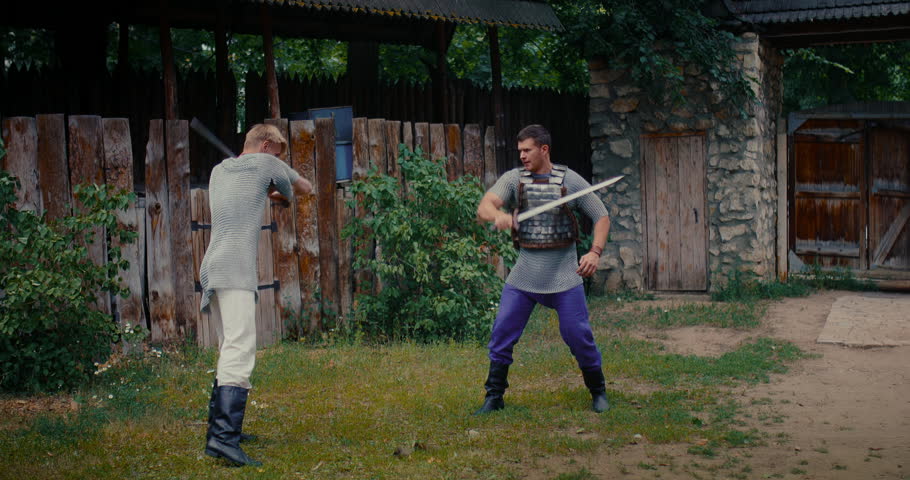 historical reenactment, two young adult men fighting with swords, medieval ages, 4K, Prores
