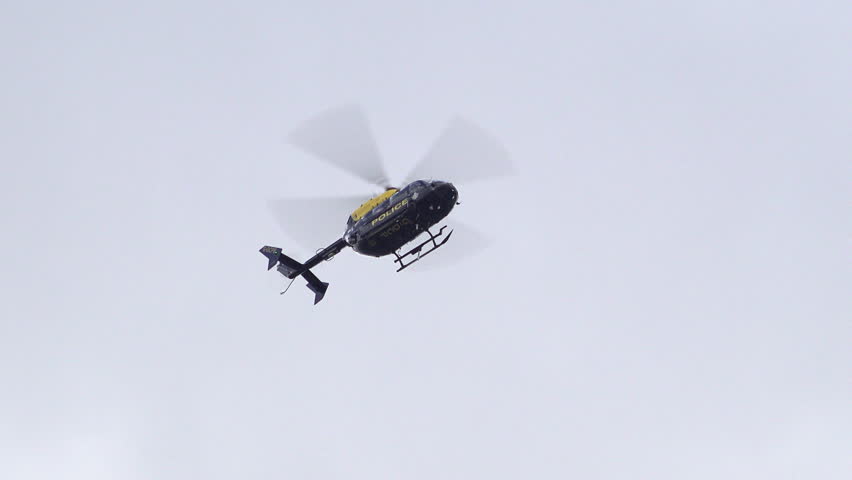 London , United Kingdom (UK) - 10 14 2023: A Police Helicopter Hovers In A Cloudy Sky