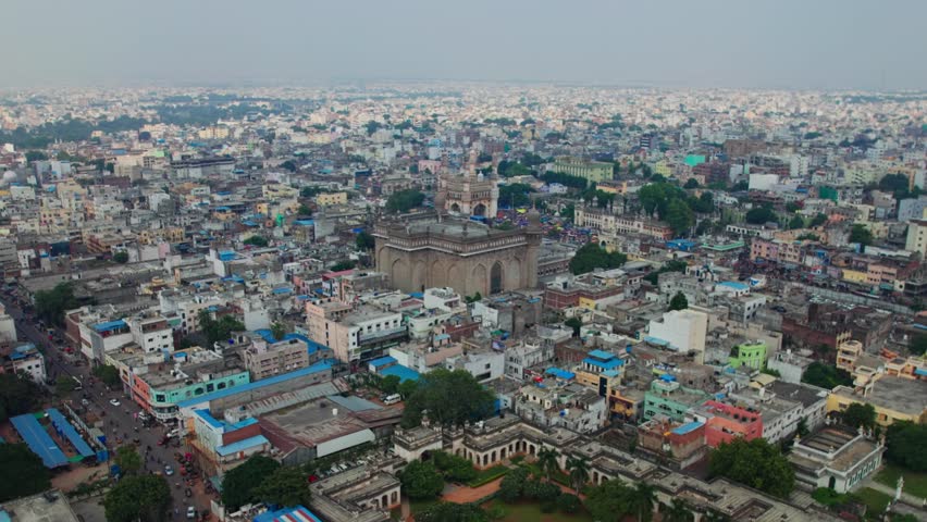 aerial view of charminar and mecca masjid surrounded by buildings in old city, hyderabad, telangana