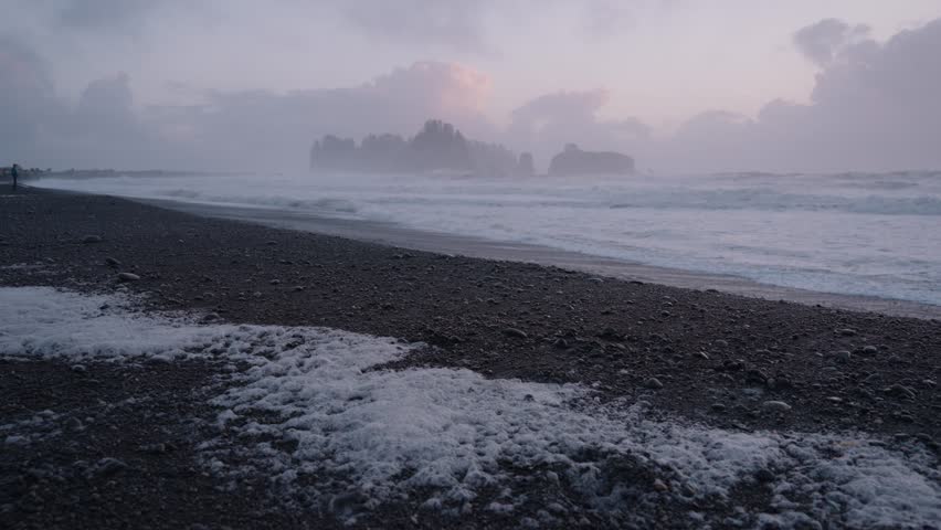 Misty Sunset and Slow Motion Waves at Rialto Coastal Ocean Beach on the Pacific Northwest in Washington, USA
