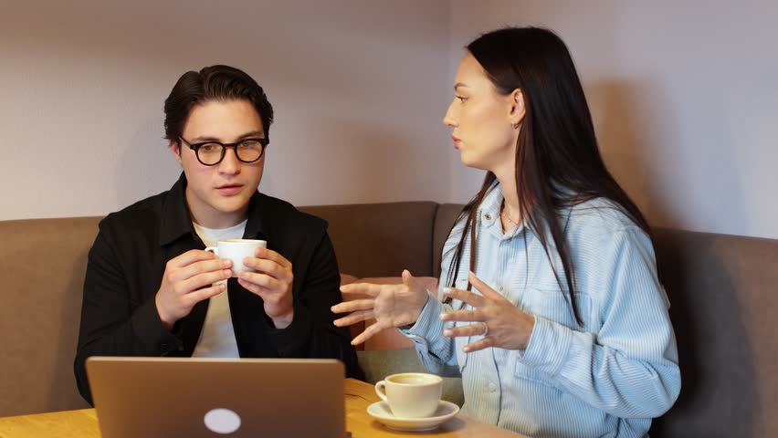 Gen z millennial teenagers guy and girl using laptop. testing startup business