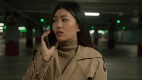 Upset sad Asian woman chinese korean japanese businesswoman talking mobile phone alone in car parking call taxi disappointed ethnic girl talk smartphone quarrel worry bad news unpleasant conversation - Powered by Shutterstock - Get 15% off with code: PIKWIZARD15