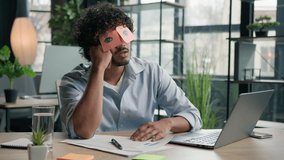Funny lazy businessman tired male business manager napping at office desk Arabian Indian man sleep closed eyes with sticky notes comical ridiculous stickers on face sleeping guy nap pretend working - Powered by Shutterstock - Get 15% off with code: PIKWIZARD15