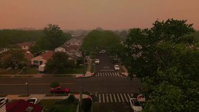 Dramatic aerial views of orange smog from Canada engulfing entire Brooklyn neighborhoods and skyline. 