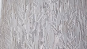 White wallpaper texture background a clean and versatile canvas, exuding timeless elegance. The delicate, tactile texture of this white wallpaper adds depth and sophistication. High quality 4k footage