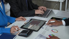 Financial analyst analysis business financial report on digital tablet during discussion at meeting of corporate showing the results of their successful teamwork, business meeting concept, Marketing - Powered by Shutterstock - Get 15% off with code: PIKWIZARD15