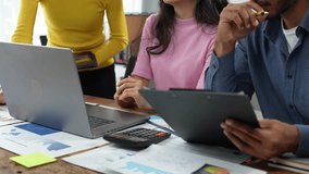 Financial analyst analysis business financial report on digital tablet during discussion at meeting of corporate showing the results of their successful teamwork, business meeting concept, Marketing - Powered by Shutterstock - Get 15% off with code: PIKWIZARD15