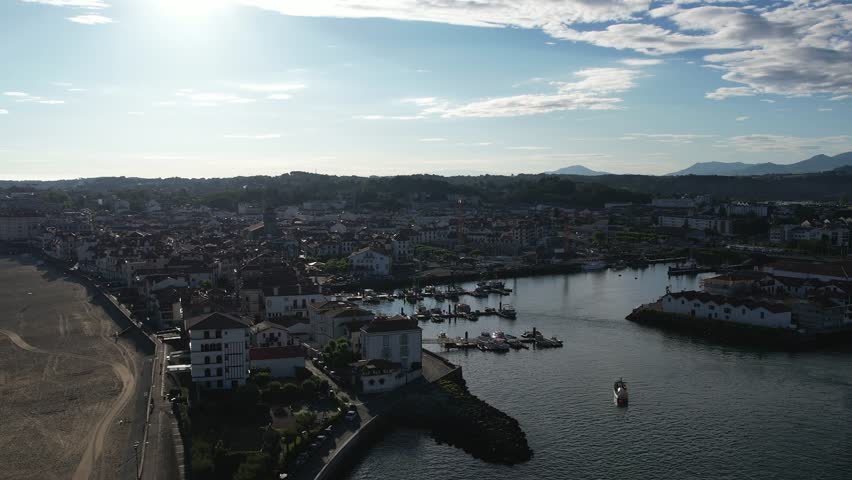 Aerial flyover above Saint-Jean-de-Luz, France at sunrise