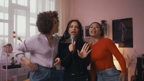 Cheerful African American women enjoying karaoke during girls night, friendship - Powered by Shutterstock - Get 15% off with code: PIKWIZARD15