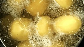 Potatoes are boiled in a saucepan. Filmed on a high-speed camera at 1000 fps. High quality FullHD footage