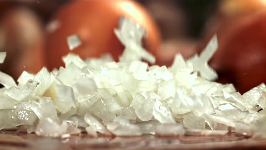 Chopped onions fall on the cutting board. Filmed on a high-speed camera at 1000 fps. High quality FullHD footage