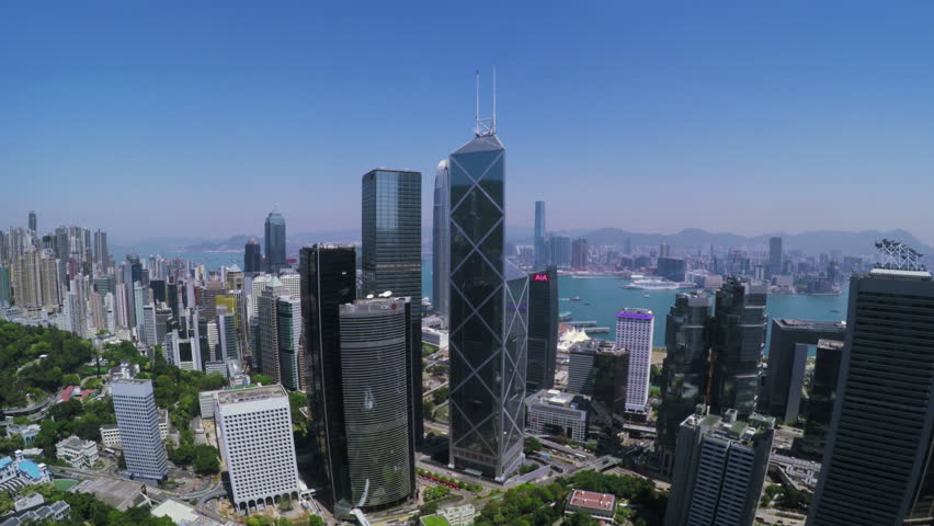 Beautiful Clear Sky Hong Kong City Aerial.
4K Aerial view of Central of Hong Kong. Tight aerial forward shot flying over office buildings and skyscrapers.
