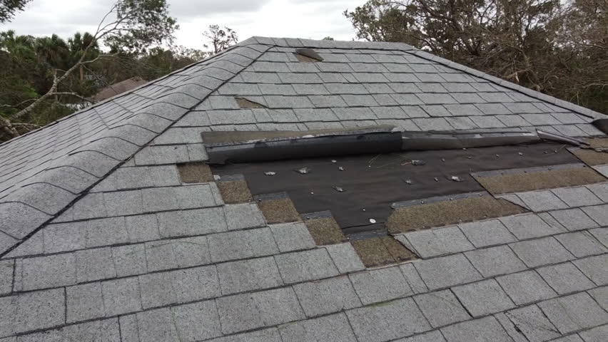 House roof damage from strong hurricane storm winds and rain water for insurance claim Royalty-Free Stock Footage #1110330305