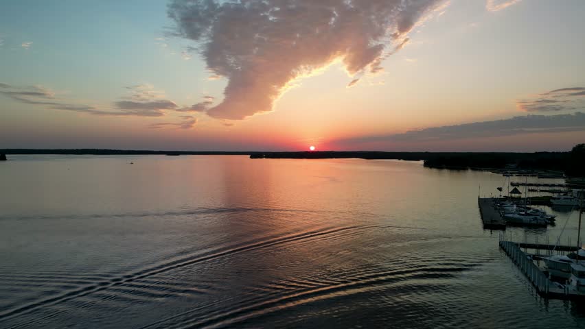 Aerial view of sunset over calm lake with reflection, Michigan