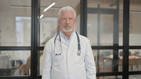 Thumbs Up by Senior Old Doctor Standing in Hospital - Powered by Shutterstock - Get 15% off with code: PIKWIZARD15